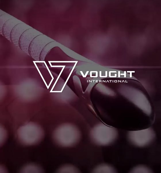Imagem com logo da Vought International centralizada e um sex toy inspirado em The Boys ao fundo.